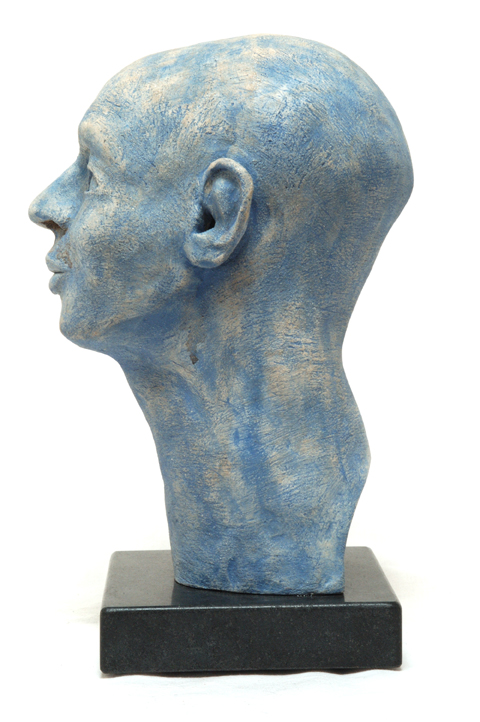 Blue Head, glazed stoneware on a marble base.